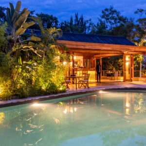 InstyleTouristik_RuandaGorillaSafari-luxury_copyright GoVacBlackThe Retreat Main Salt water pool lighting at night